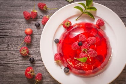 A plate of fruit jelly with berries